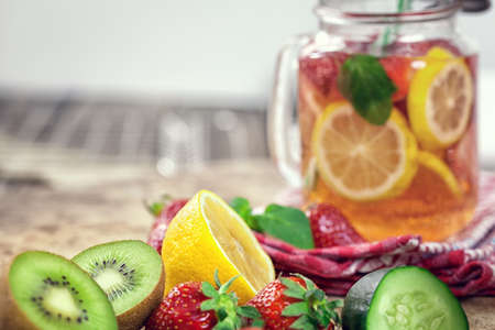 Infused Water with Fresh Strawberries, Lemon, Cucumber, Kiwi and Mintの写真素材