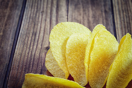 Tacos - Mexican yellow corn tortilla , empty shell on wooden cutting board