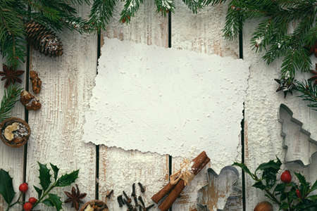 Christmas wooden background with spices and snow - copy spaceの写真素材