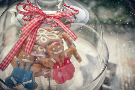 Christmas Gingerbread cookie on glass stand with snow flakes