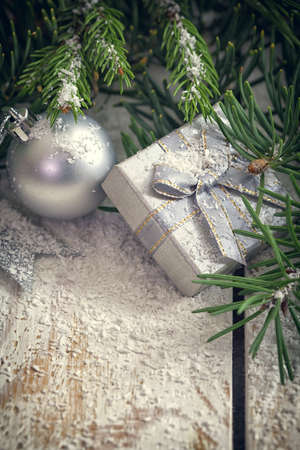 Christmas garland on rustic white wooden table with copy spaceの写真素材