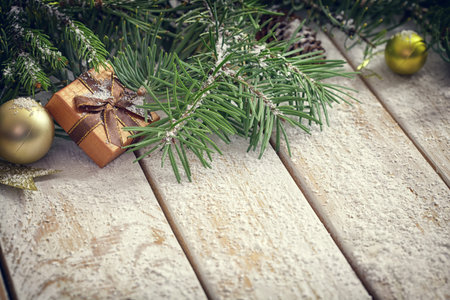 Christmas garland on rustic white wooden table with copy spaceの写真素材