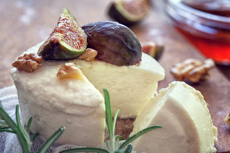 Ricotta with ripe sliced fig fruits, nuts and honeyの写真素材