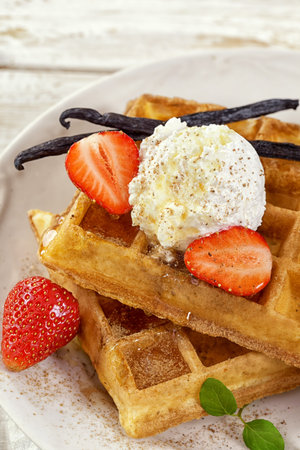 Waffles with Fresh Strawberries and Vanilla ice creamの写真素材