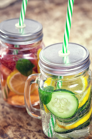 Infused Water with Fresh Strawberries, Lemon, Cucumber, Kiwi and Mintの写真素材