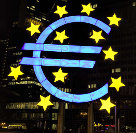 Illuminated EURO sign at night, Frankfurt, Germanyの写真素材