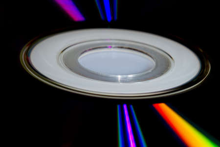 Close up - Light beams on a compact discの写真素材