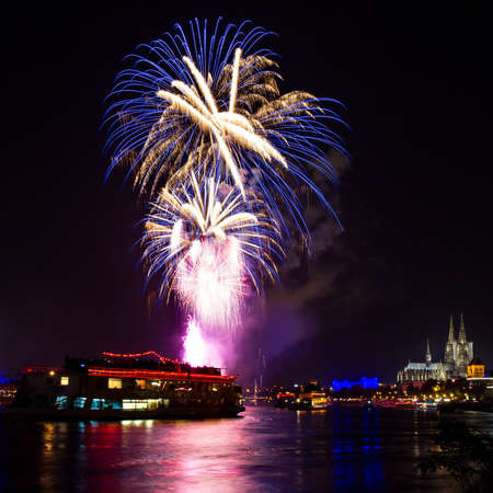 Blue fireworks over Cologne with the famous cathedral, Germanyの写真素材