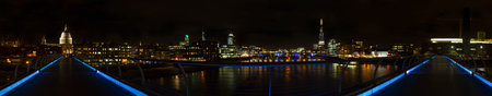 Panorama of London at night as seen from the Millennium Bridge, Englandの写真素材