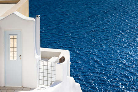 The White door and the blue sea, Santorini, Greeceの写真素材