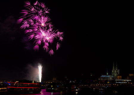 Colorful firework over the river Rhine, Cologne, Germany