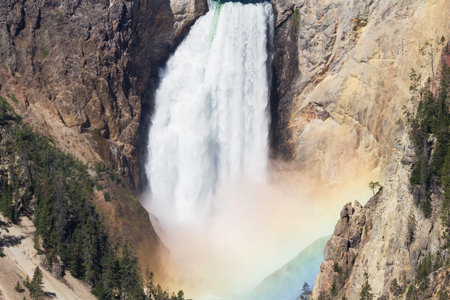 Rainbow at the Lower Falls of the Yellowstone river, Wyoming, USAの写真素材