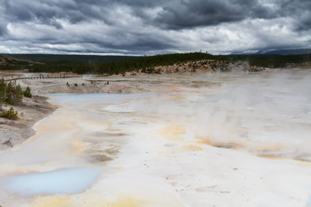 Norris Geyser Basin under dark clouds, Yellowstone NationalPark, Wyoming, USA