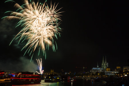 Colourful firework in front of the cathedral of Cologne, Germanyの写真素材