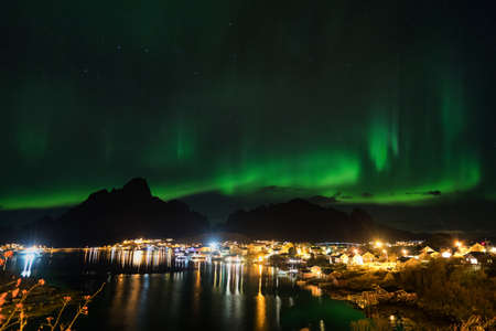 Northern lights over the vilage of Reine, Lofoten, Norwayの写真素材