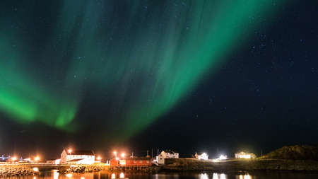 Northern lights over the vilage of Sakrisoy, Lofoten, Norwayの写真素材
