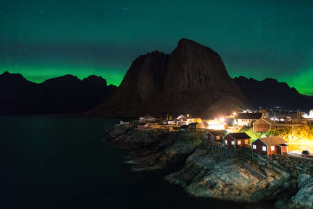 Northern lights over the vilage of Hamnoy, Lofoten, Norwayの写真素材
