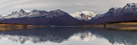 Mountain range reflecting in Lake Argentina, Patagonia, Argentinaの写真素材