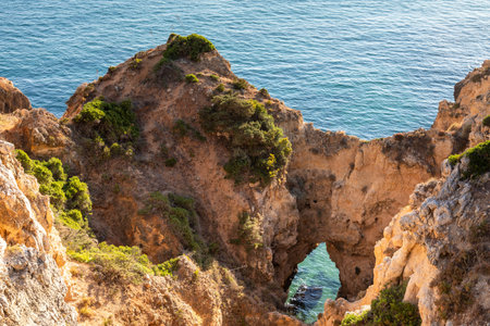 Natural arch at Ponta da Piedade in the evening light, Lagos, Algarve, Portugal