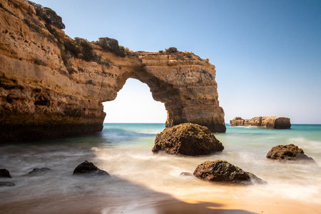 Stone arch at Praia de Albandeira, Lagoa, Algarve, Portugalの写真素材