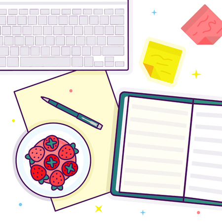 Flat lay with open book, strawberry, keyboard and stickersの写真素材