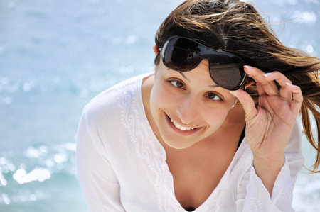 Beautiful young woman on the beach