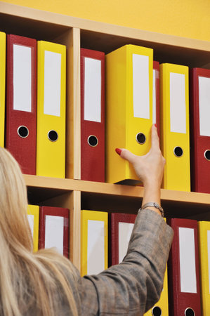 Business woman taking folder