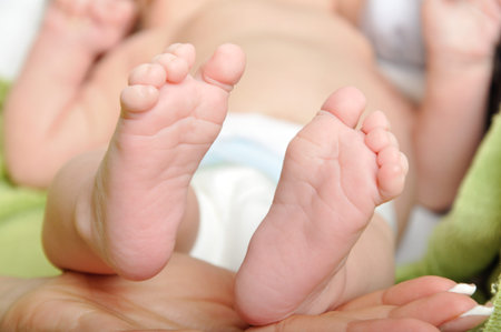 Baby feets in mommy's hand