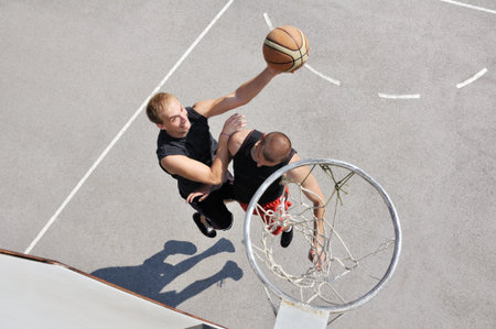 Two basketball players on the court