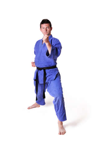Karate man posing on a white backgroundの写真素材