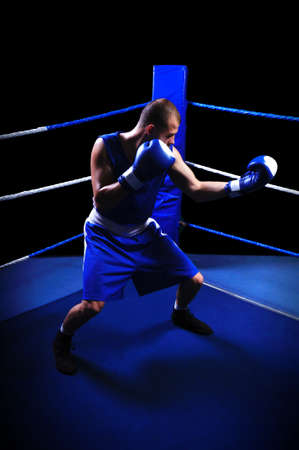 Male boxer in ring doing exerciseの写真素材