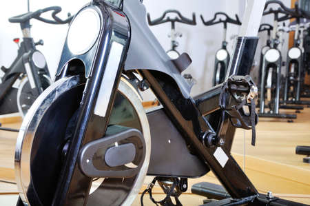 Group of spinning bicycles at fitness studioの写真素材