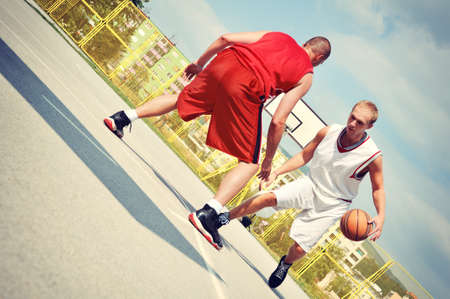 Two basketball players on the courtの写真素材