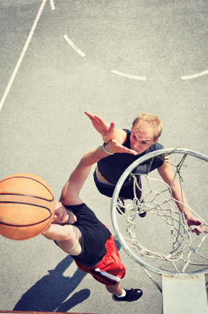 Two basketball players on the court