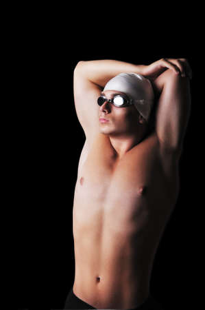 Male swimmer isolated on blackの写真素材