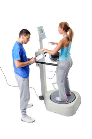 Sports Scientist doing Balance Assessment with Professional Equipment. Modern Technology.の写真素材