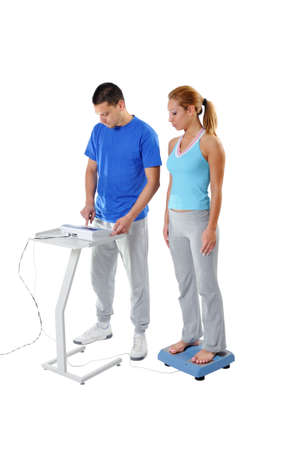 Sports Scientist doing Balance Assessment with Professional Equipment. Modern Technology.の写真素材