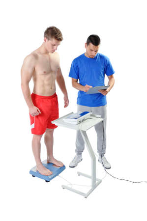 Sports Scientist doing Balance Assessment with Professional Equipment. Modern Technology.の写真素材