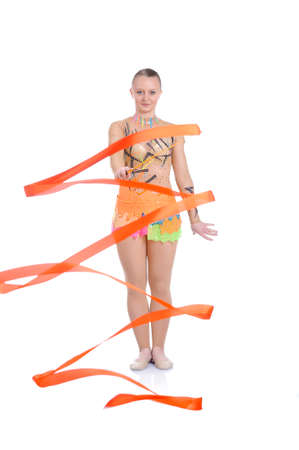 Beautiful artistic female gymnast working out, performing art gymnastics elementの写真素材