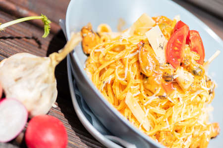 Pasta, spaghetti with cheese, mushrooms and tomato. Healthy food.の写真素材