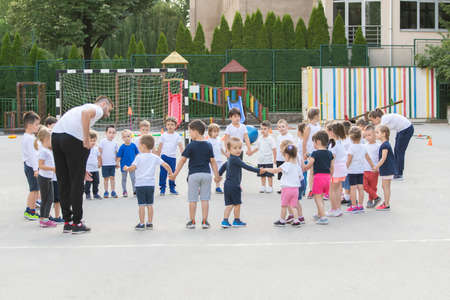 Group of children warming up and preparing for the main part of lesson.  Sport schoolの写真素材