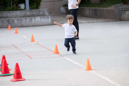 Beautiful little boy doing sports polygon.の写真素材