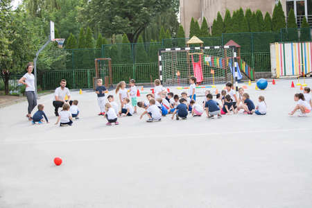 Group of children warming up and preparing for the main part of lesson.の写真素材