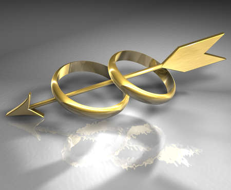 wedding rings and gold arrowの写真素材