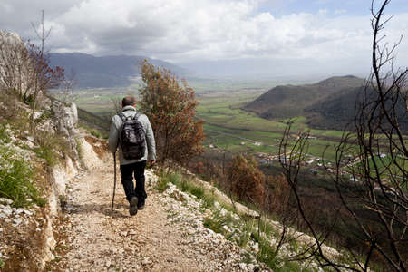 Hiker on mountain trailの写真素材
