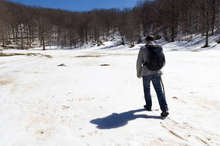 hiker on mountain trail with snow in matese parkの写真素材