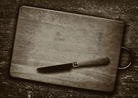 Artistic knife on cutting boardの写真素材