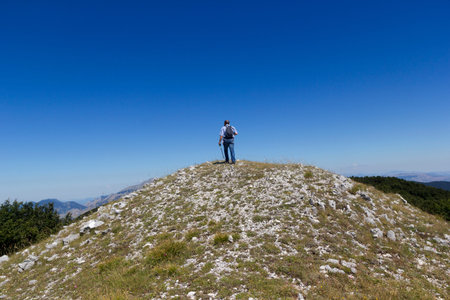 Hiker on mountain trailの写真素材