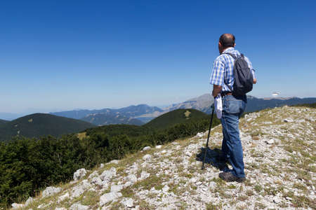 Hiker on mountain trailの写真素材
