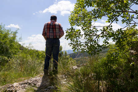 Hiker on mountain trailの写真素材
